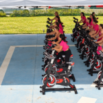 Incorporadora transforma sede em espaço fitness e reúne mais de 80 mulheres em aula de spinning em Itapema
